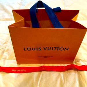 Louis Vuitton shopping bag and red LV ribbon